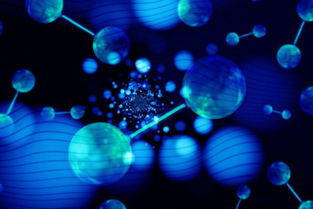 Digital representation of hydrogen molecules in blue tones with connections and particles dispersing.